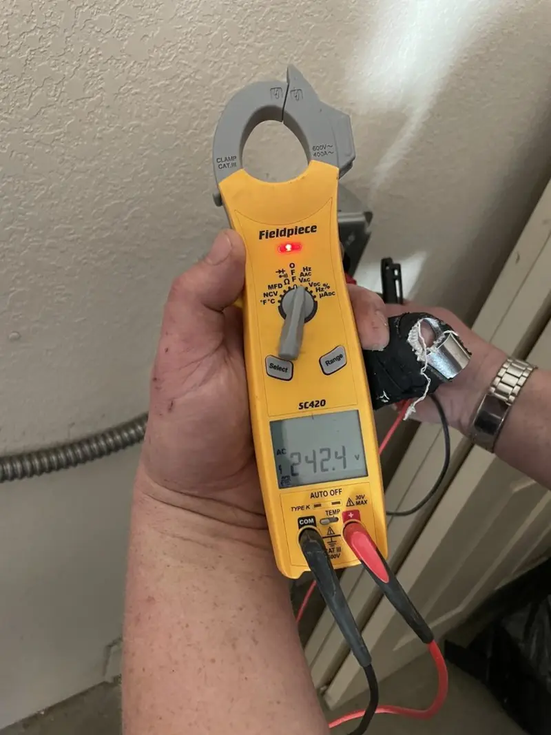 Voltage testing with clamp meter during Ceiling Fan Installation in West Brookfield